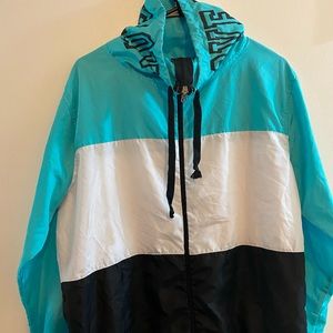 windbreaker jacket turquoise white and black